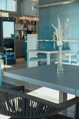 Concept details of the interior of the restaurant and cafe. Details of the interior with wheat ears in a vase. Modern design.