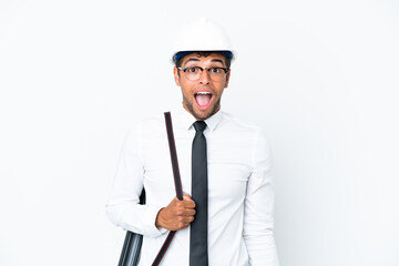 Architect brazilian man with helmet and holding blueprints with surprise facial expression