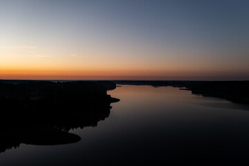 Obraz premium Sunrise over a lake in Poland from a drone