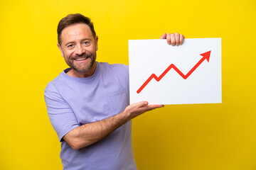 Middle age caucasian man isolated on yellow background holding a sign with a growing statistics...