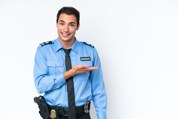 Young police caucasian man isolated on white background presenting an idea while looking smiling towards