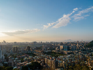 Fototapeta na wymiar Sunset aerial view of the cityscape of Wenshan District of Taipei from Xianjiyan