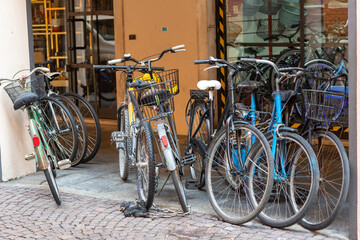 Fototapeta na wymiar Old bicycles leaning against the wall of a building