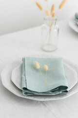 Table linens decoration with green linen napkins