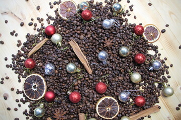 coffee beans with spices and Christmas decoration on wooden background