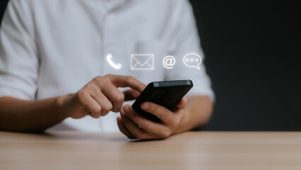 Customer support hotline Contact us people connection. Businessman using Smart Phone with the