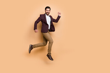 Fototapeta na wymiar Full body photo of handsome businessman running to office station company workshop isolated on beige color background