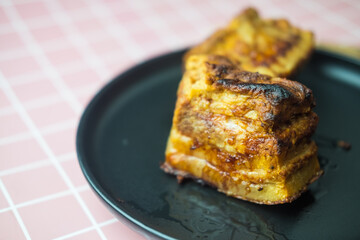 Side view of crispy golden pork belly. Deep fried crispy pork belly