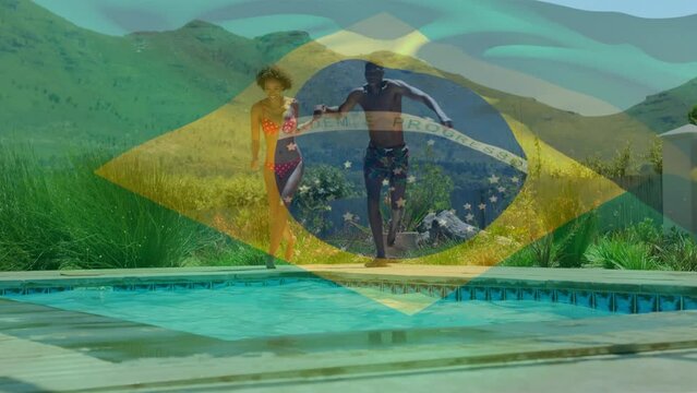 Animation of waving brasil over happy african american couple swimming in pool