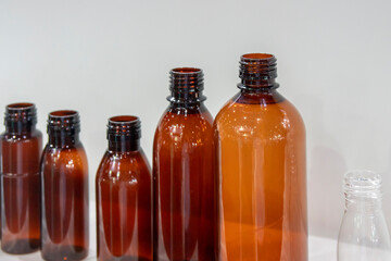 The various size of brown bottles container.