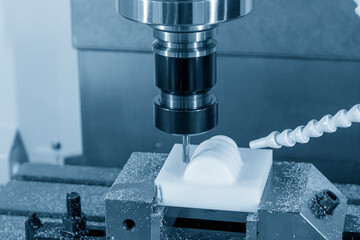 The CNC milling machine cutting the plastic material parts by solid ball endmill tool.