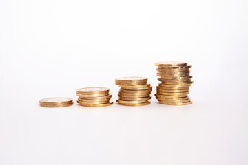  Close-up of coins stack on white background. 
