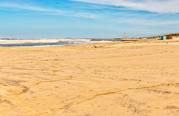Fototapeta na wymiar Lighthouse, lifeguard tower on the beach. Praia da Costa Nova and Praia da Barra, Aveiro, Portugal