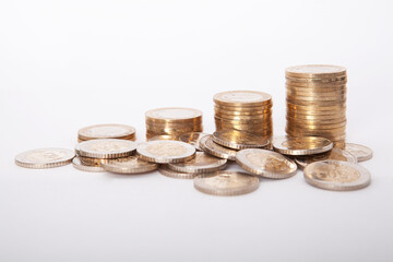  Close-up of coins stack on white background. 