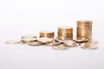  Close-up of coins stack on white background. 