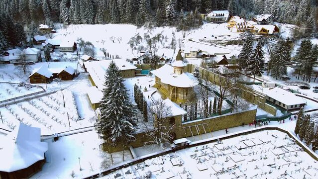Aerial footage of medieval Voronet Monastery, located in Suceava county, Romania. Video was shot from a drone while flying backwards from the monastery, gaining altitude.
