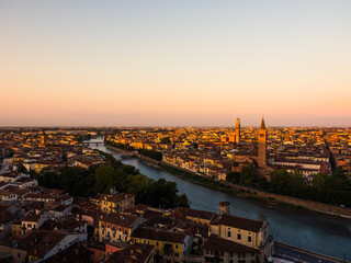 Fototapeta na wymiar sunrise in the old town of verona, italy with beautiful golden colors