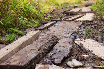 Real planks on muddy road