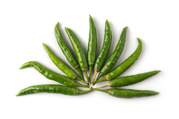 green chillies arranged on white background, common vegetable used for their spicy taste