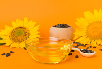 Sunflower oil, and flower on color background