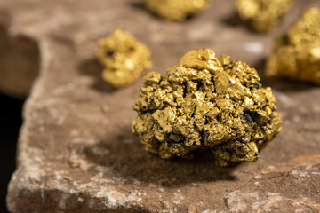 The pure gold ore found in the mine on a stone floor