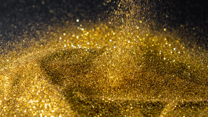 Sprinkle glitter gold dust sand in the dark textured abstract background elegant for Merry...