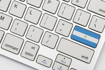 national flag of nicaragua on the keyboard on a grey background .3d illustration
