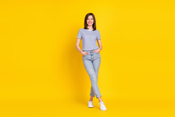 Fototapeta na wymiar Full size photo of good looking lady arm jeans pants legs folded dressed nice outfit stand empty space isolated on yellow color background