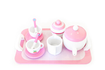 A set of pink white pastel color wood  toy tea cups including 2 coffee cups with teaspoons, a...