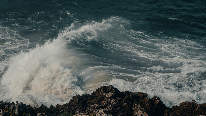 waves crashing on rocks
