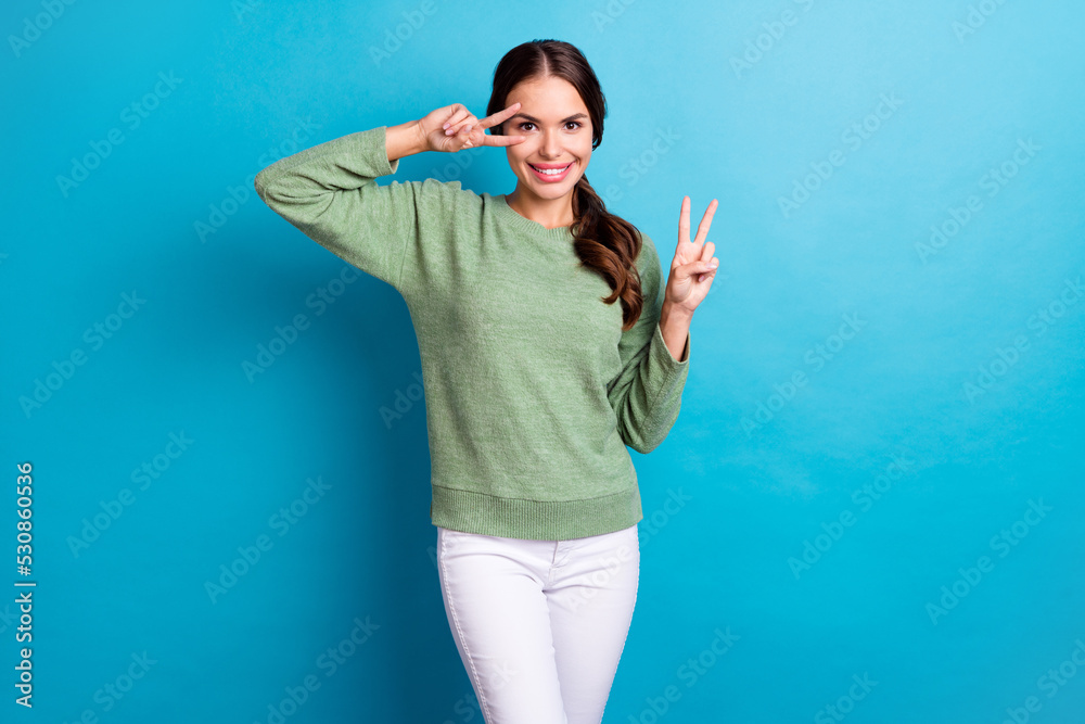 Canvas Prints Portrait of nice satisfied lady have good mood show v-sign near eye isolated on blue color background