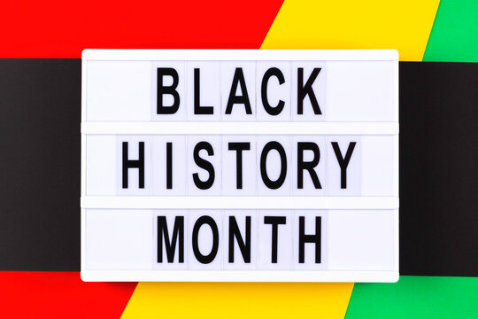 Lightbox with text Black History Month on red, yellow, green, black color background. Top view