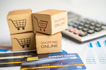 Shopping online box with credit card and calculator on graph. Finance commerce import export...