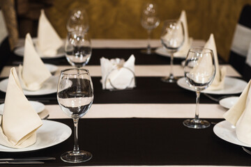 Banquet table with wineglasses. High angle of elegant banquet table served for wedding celebration