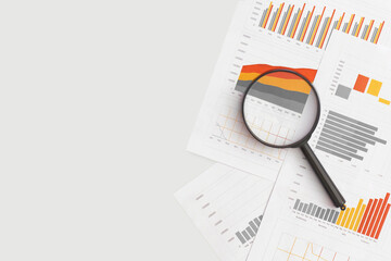 Business graphs, charts and magnifying glass on table. Financial development, Banking Account,...