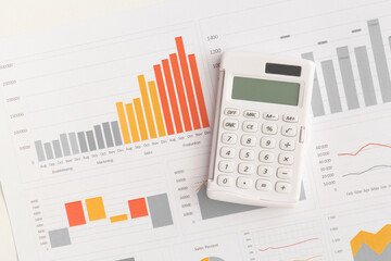 Business graphs, charts and calculator on table. Financial development, Banking Account, Statistics