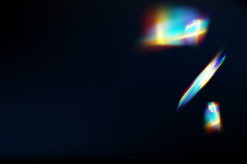 Rainbow highlights on a black background.Glare or reflection from water and glass.Glittering particles for social media backgrounds, product presentations, photo shots.