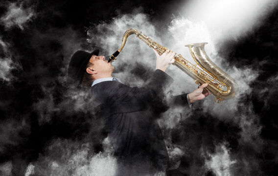 Saxophonist on smoke background
