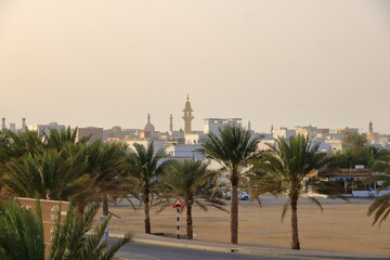 Obraz premium March 21 2022 - Sur, Oman: image of street life in Sur town with white houses in Southern Oman