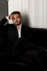 Fototapeta premium businessman sitting on the couch