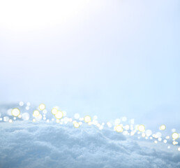 Fresh snow texture background in blue tone and sunlight.