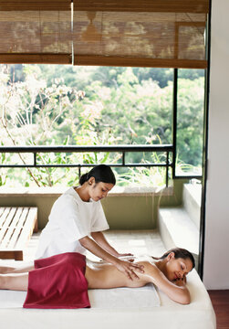 Woman Receiving Ayurvedic Massage at a Spa, Dambulla, Sri Lanka.