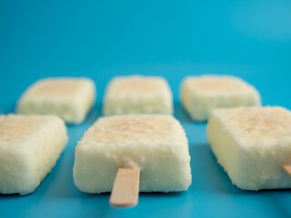 Orange ice cream with white milk chocolate.