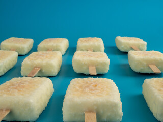 Orange ice cream with white milk chocolate.