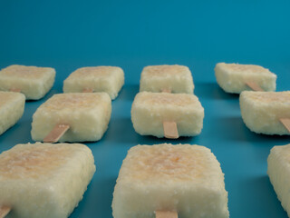 Orange ice cream with white milk chocolate.