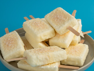 Orange ice cream with white milk chocolate.