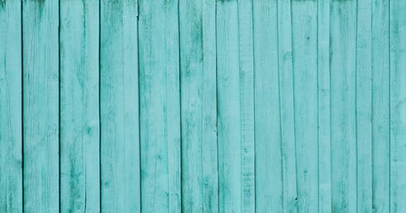Fototapeta na wymiar Painted burquoise old wooden fence