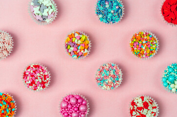 Patter from confectionery decor, the sweetest day. Abstract background. Bright background.