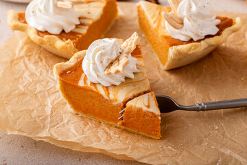 Pumpkin cheesecake swirl pie topped with whipped cream