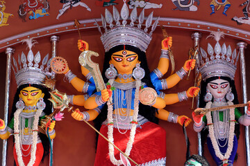 Idol of Goddess Devi Durga at a decorated puja pandal in Kolkata, West Bengal, India. Durga Puja is...